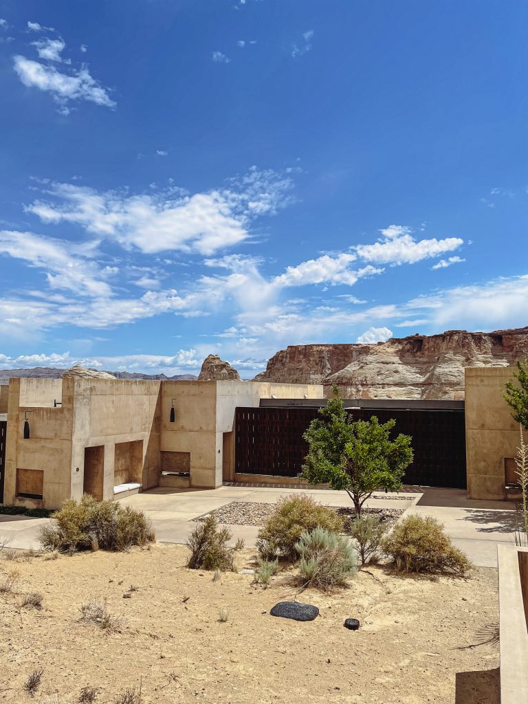 a building with a large courtyard and a desert landscape