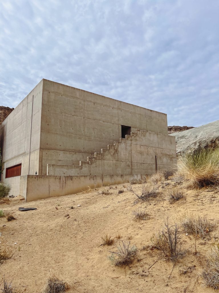 a concrete building with stairs in the desert