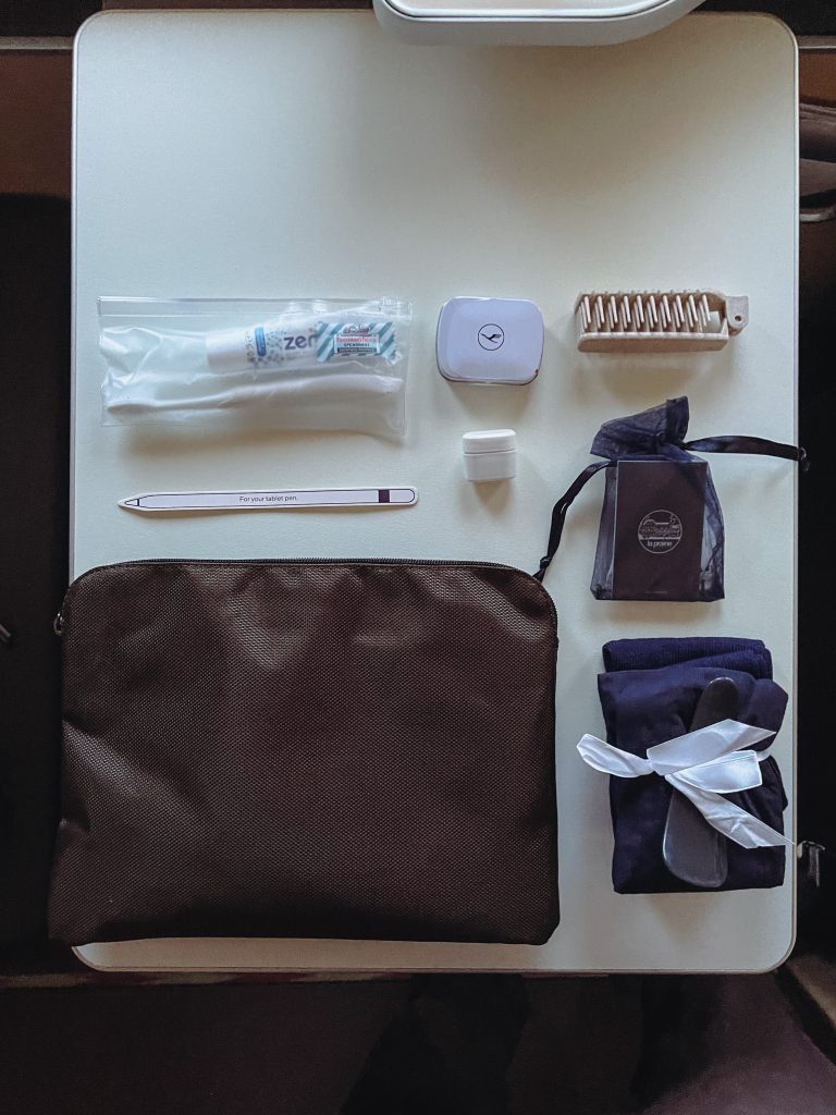 a table with a bag and items on it
