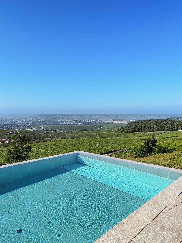 a pool overlooking a landscape