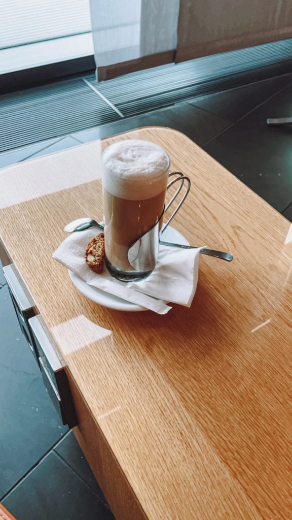 a glass mug with a drink on a table