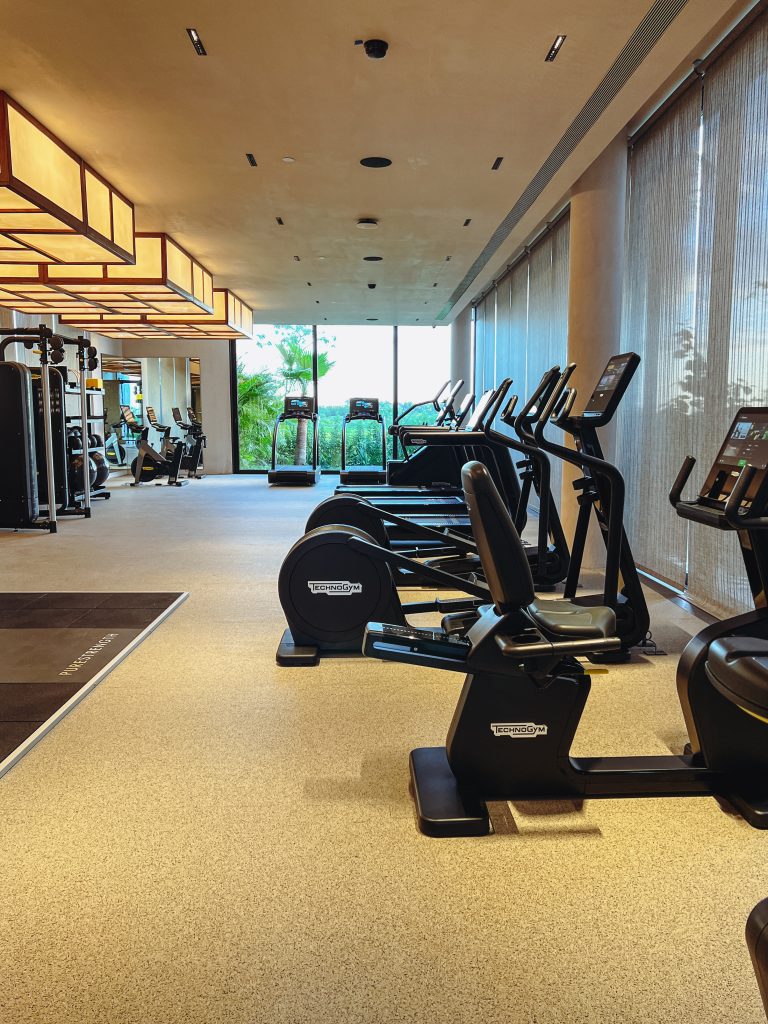 a room with exercise machines and exercise equipment