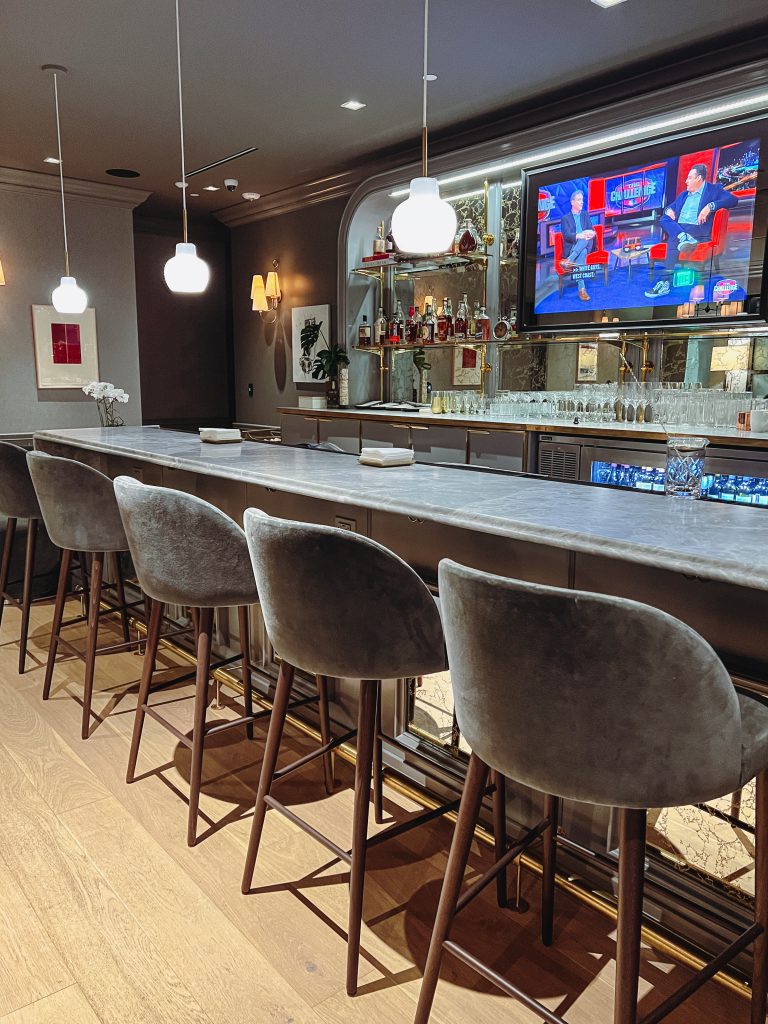 a bar with a television and a bar