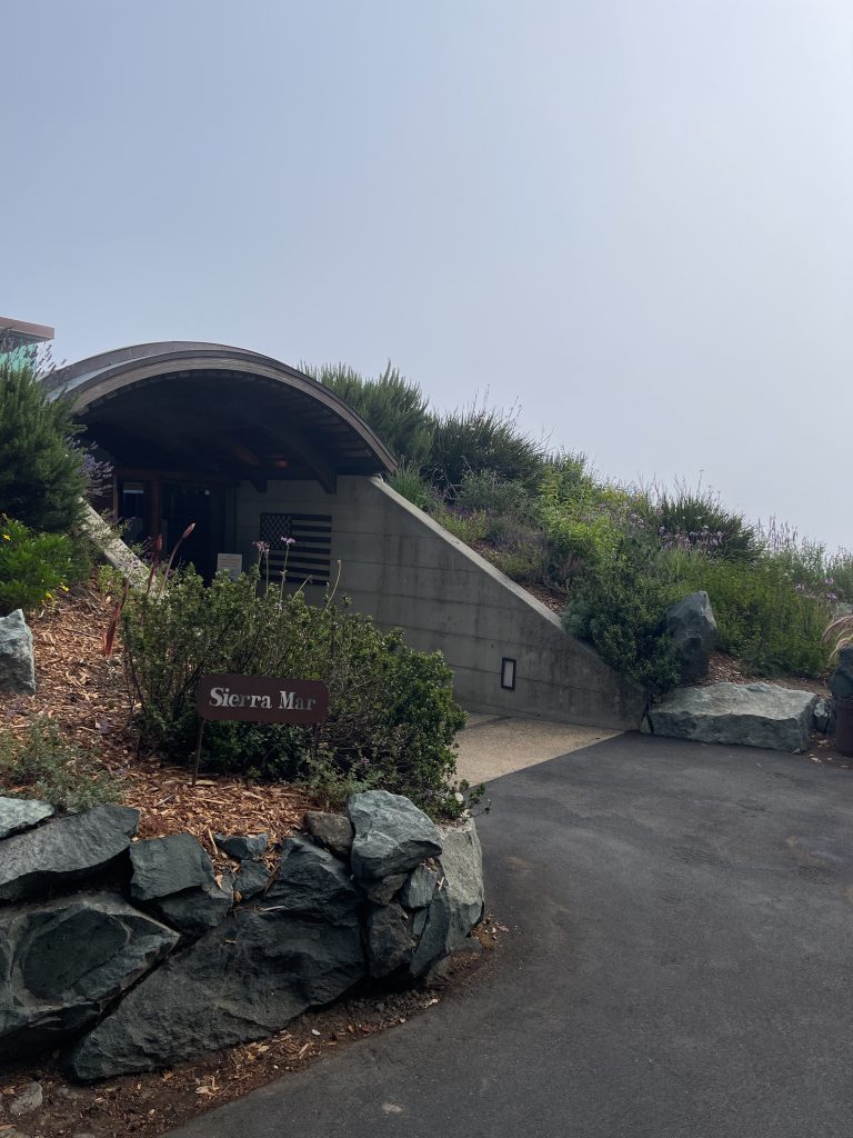 a building with a tunnel on the side of a hill