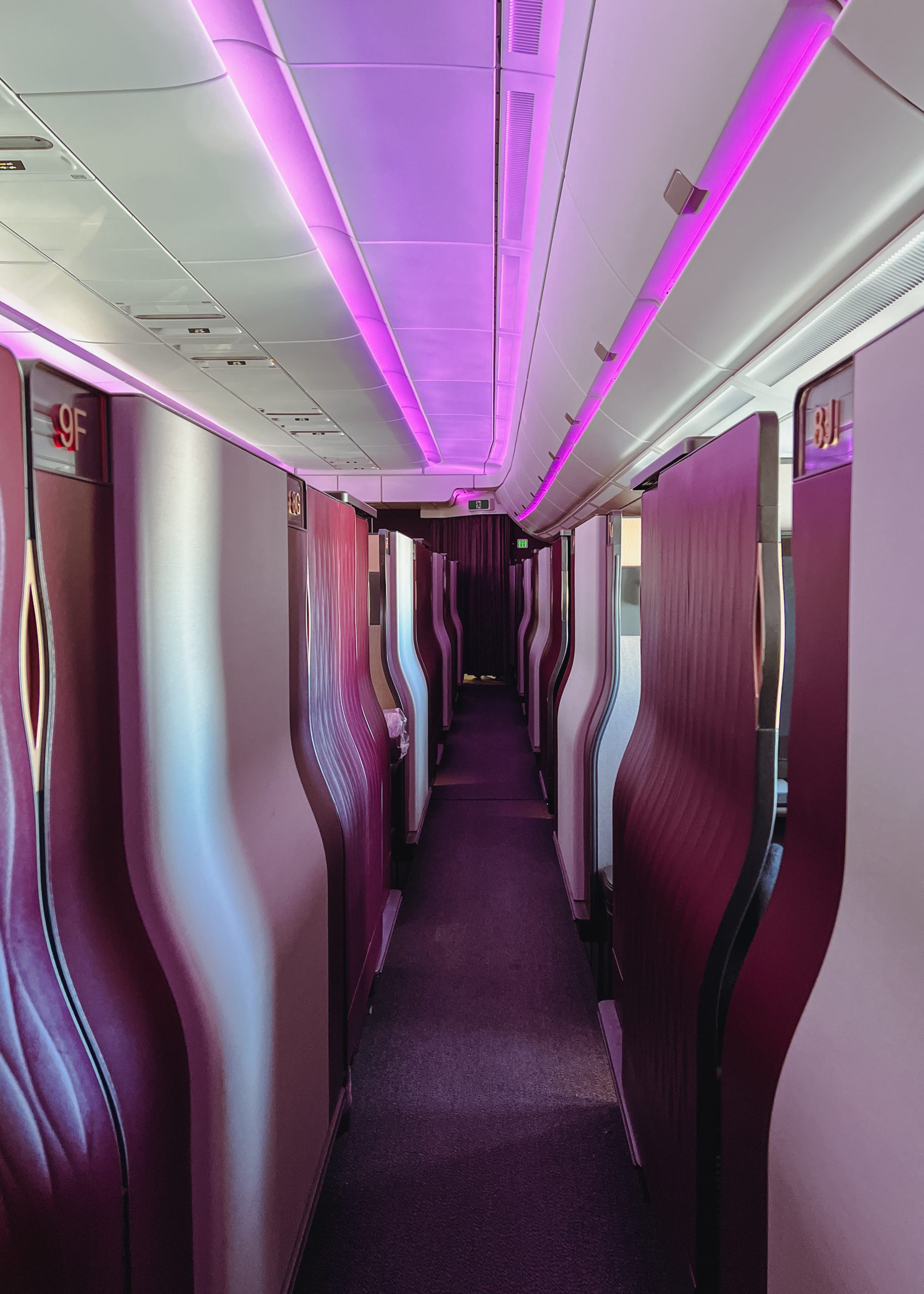 a long hallway with purple seats