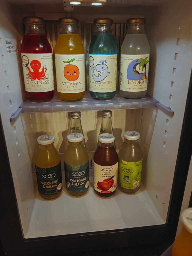 a refrigerator with bottles of liquid