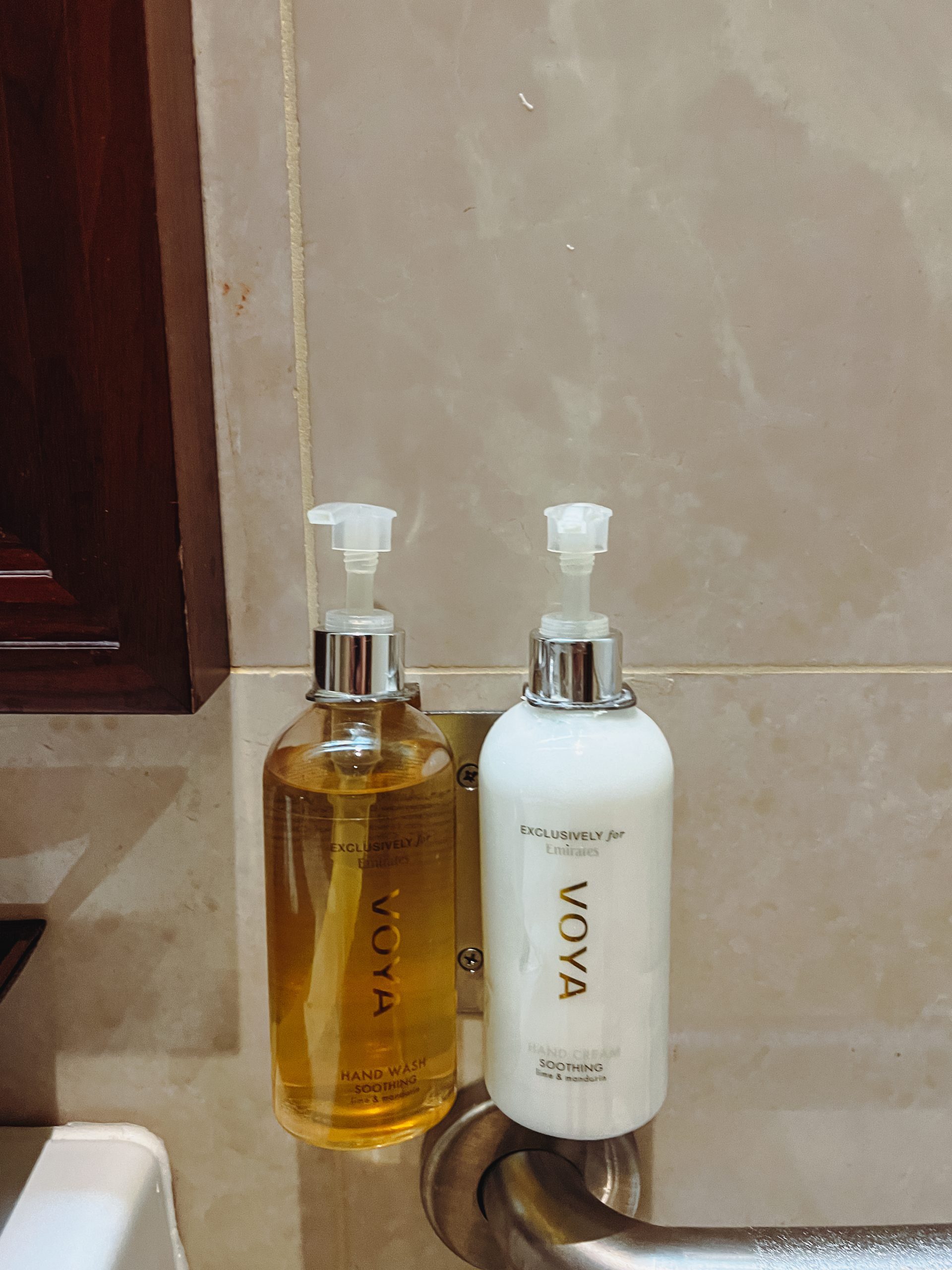 a couple of soap dispensers on a counter