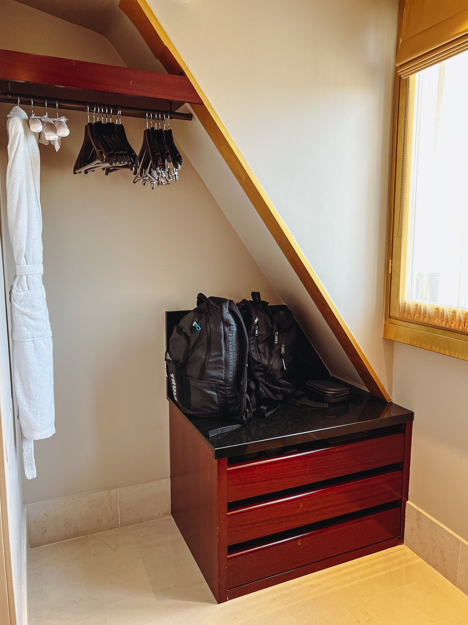 a closet with a backpack and swingers