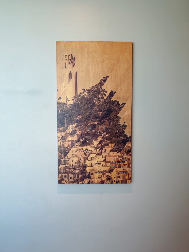a wood panel with a picture of a city