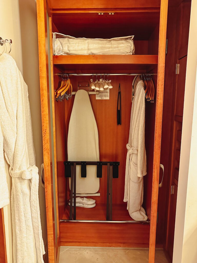 a closet with a white board and swingers