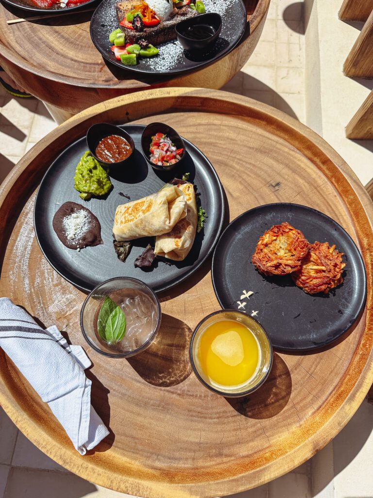 a plate of food on a wooden tray