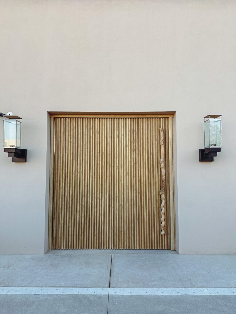 a door with a light fixture on the side