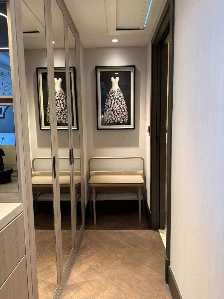 a mirror door with a picture of a dress on the wall