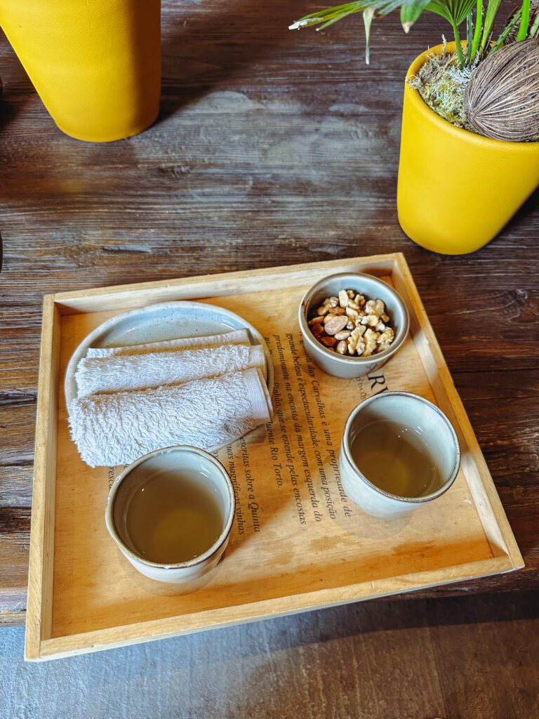 a tray with cups and a towel and a towel on it