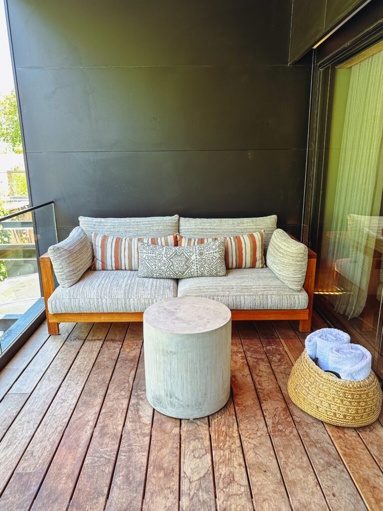 a couch and a table on a deck