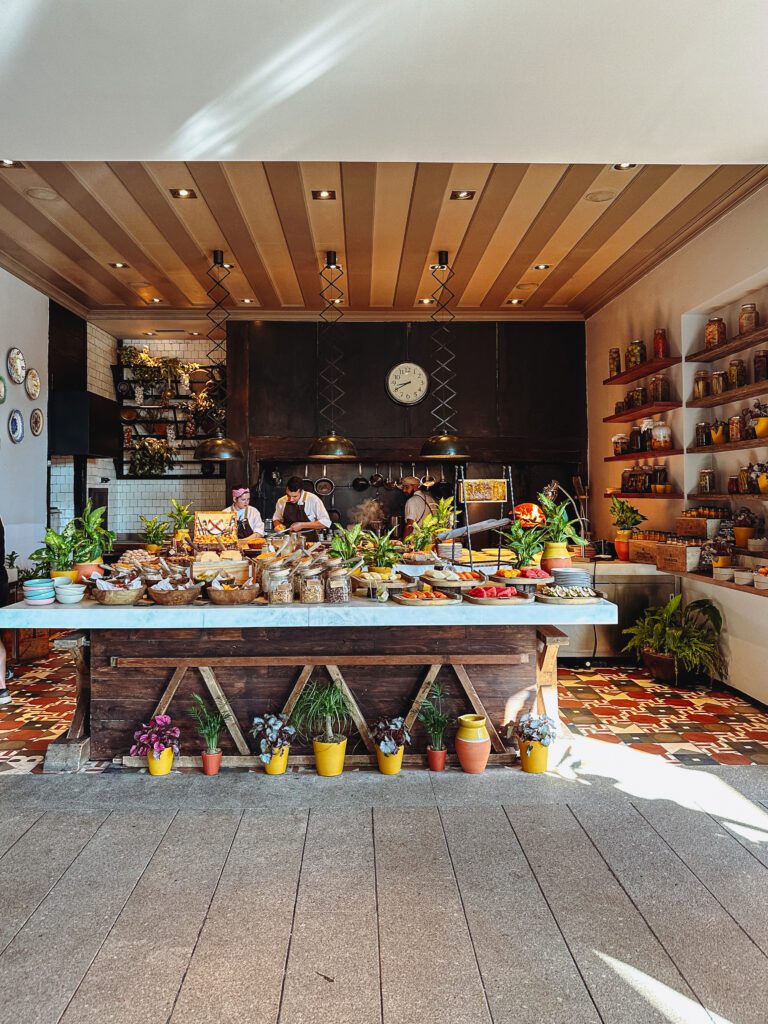 a kitchen with a counter full of food